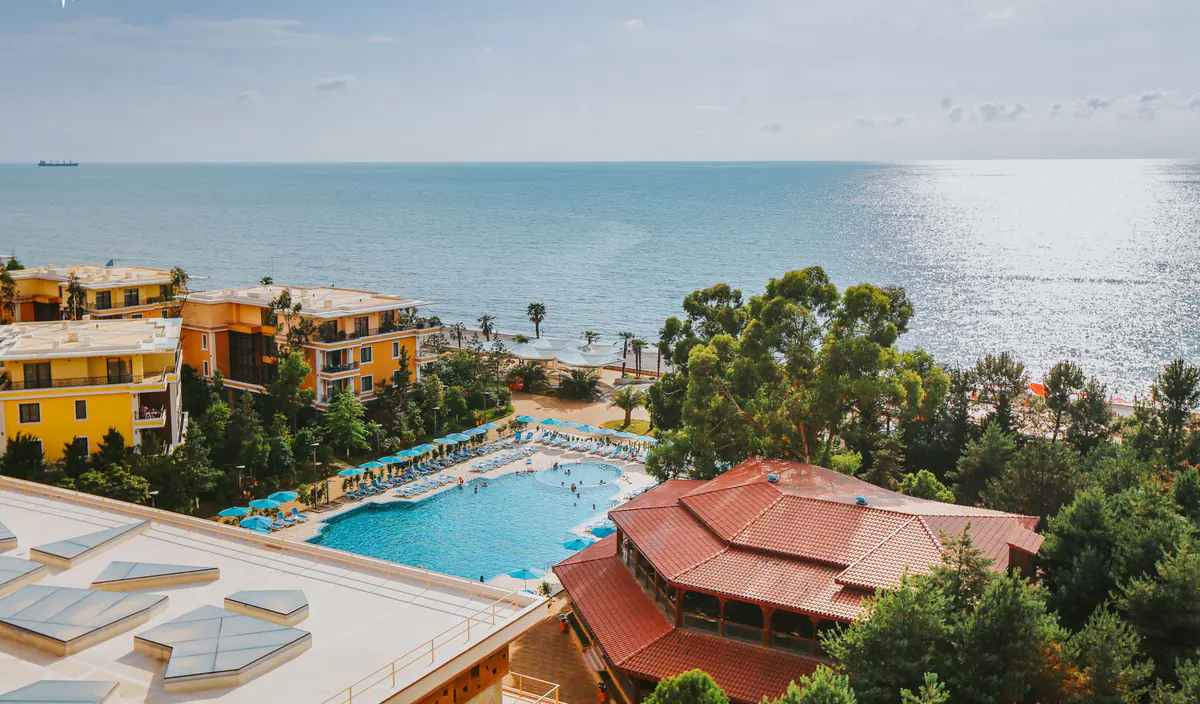 The low-rise blocks, the pool and the beach from the air